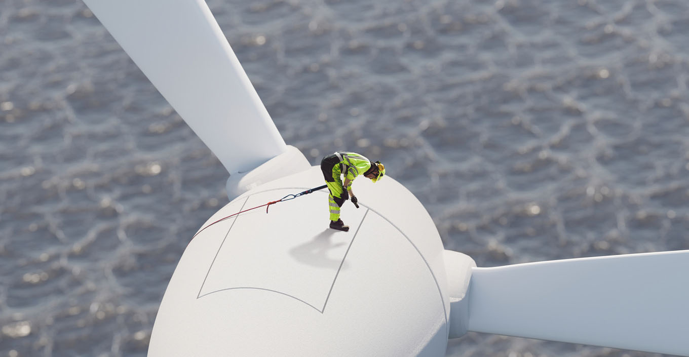 Man standing on wind turbine