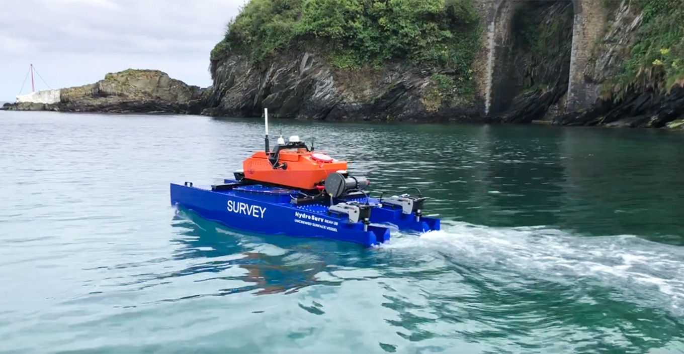 Autonomous survey vessel (ASV) sailing through the sea.