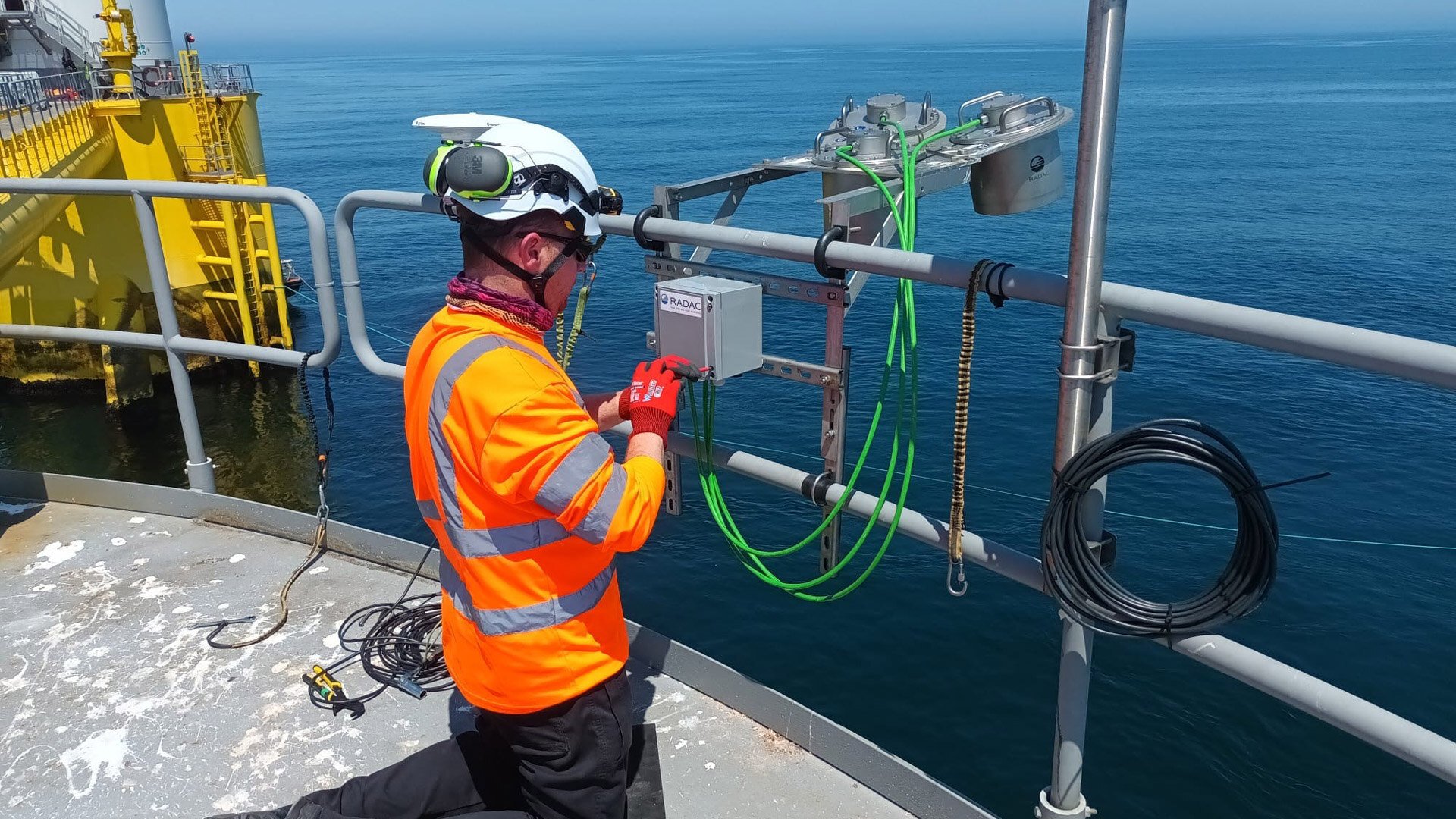 Offshore communications engineer installing a MetOcean sensor system to an offshore floating wind turbine.