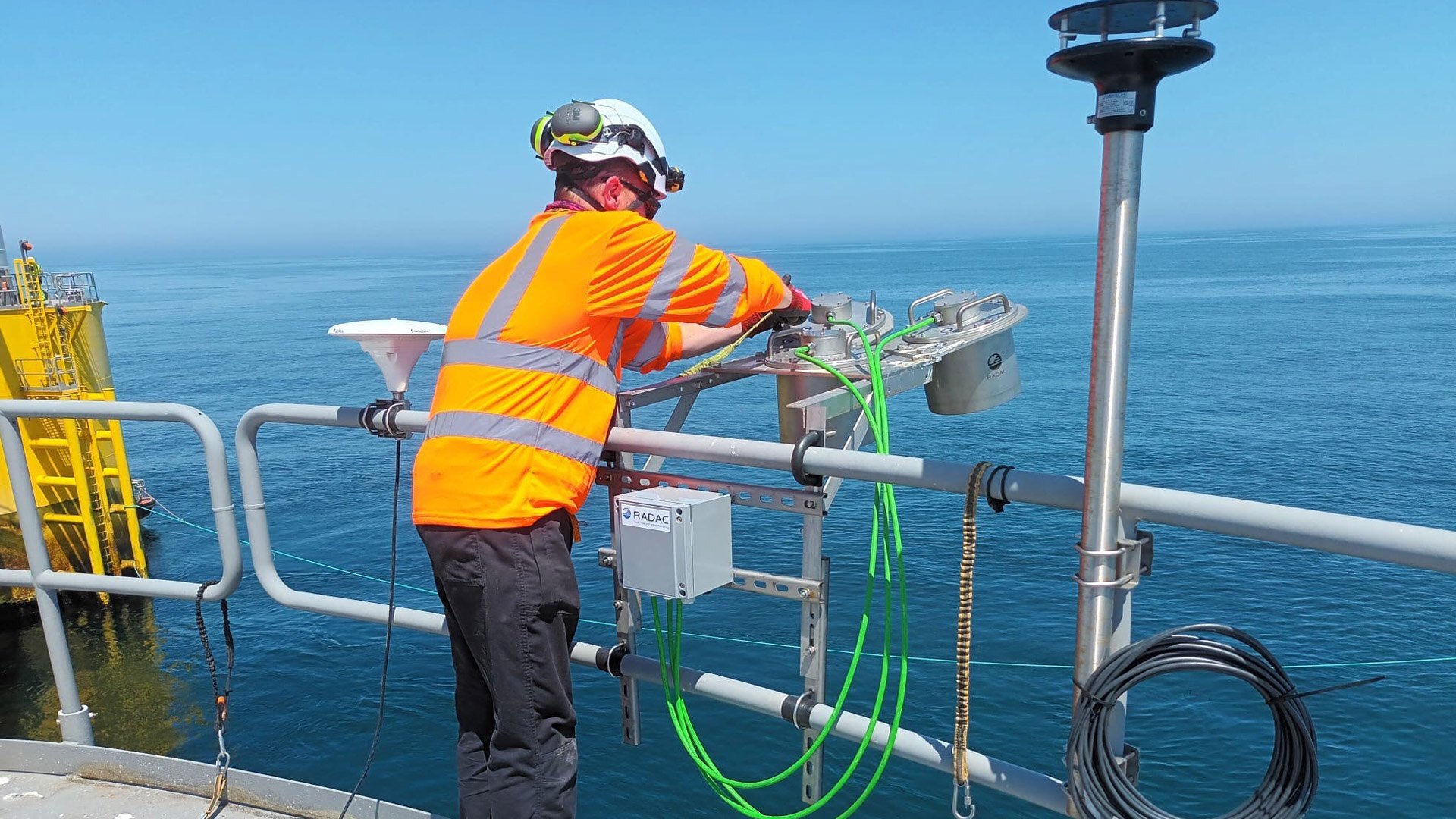 Offshore communications engineer installing a MetOcean sensor system to an offshore floating wind turbine.